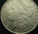 Silver dollar cleaned in a careless manner.